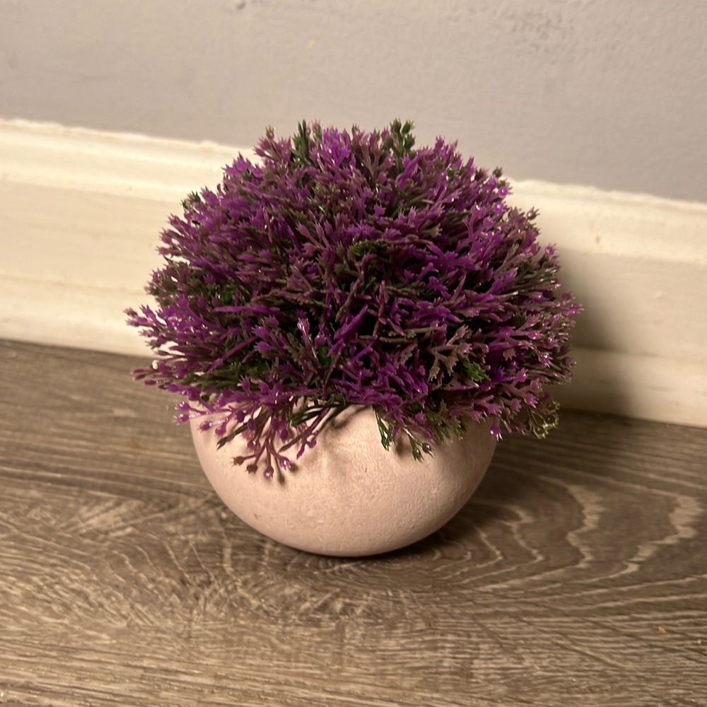 Purple fake flower in pot